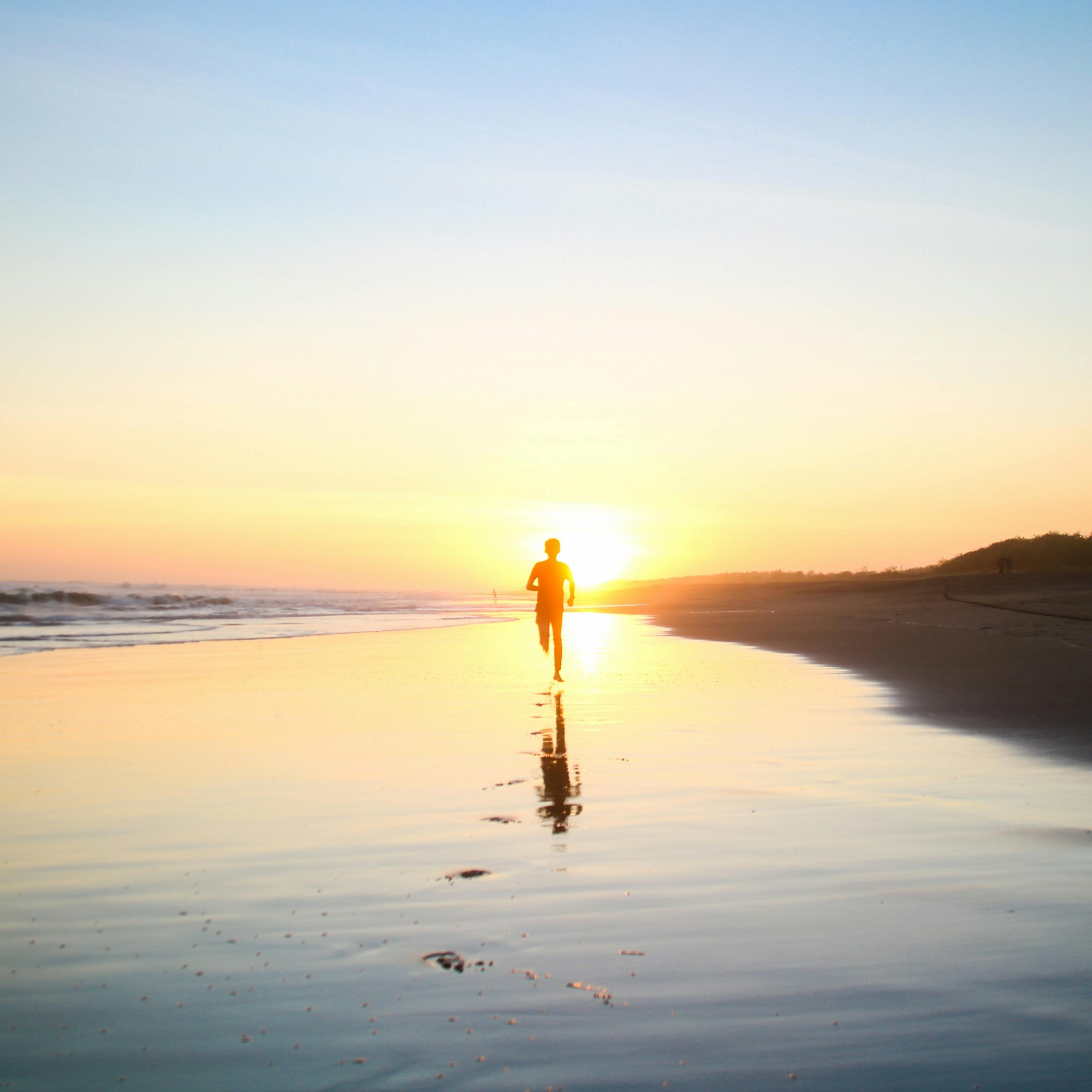 a person walking on a beach